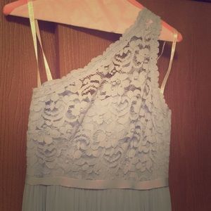 Ice blue, one-shoulder floor length dress.